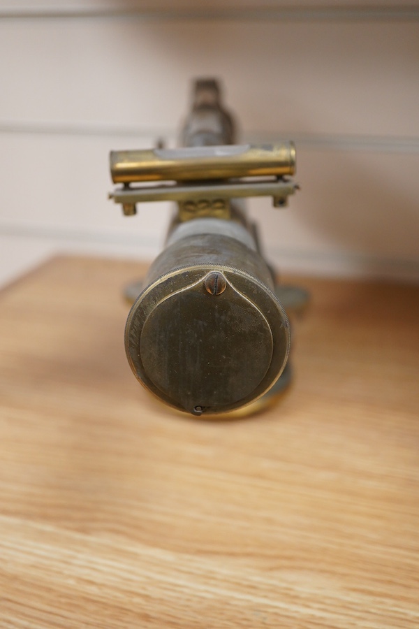 A late 19th century lacquered brass level, by R.W. Street & Co., Commerce Rd., Lambeth, with an incorporated 16 inch telescope, with an ash tripod, uncased, 41cm long